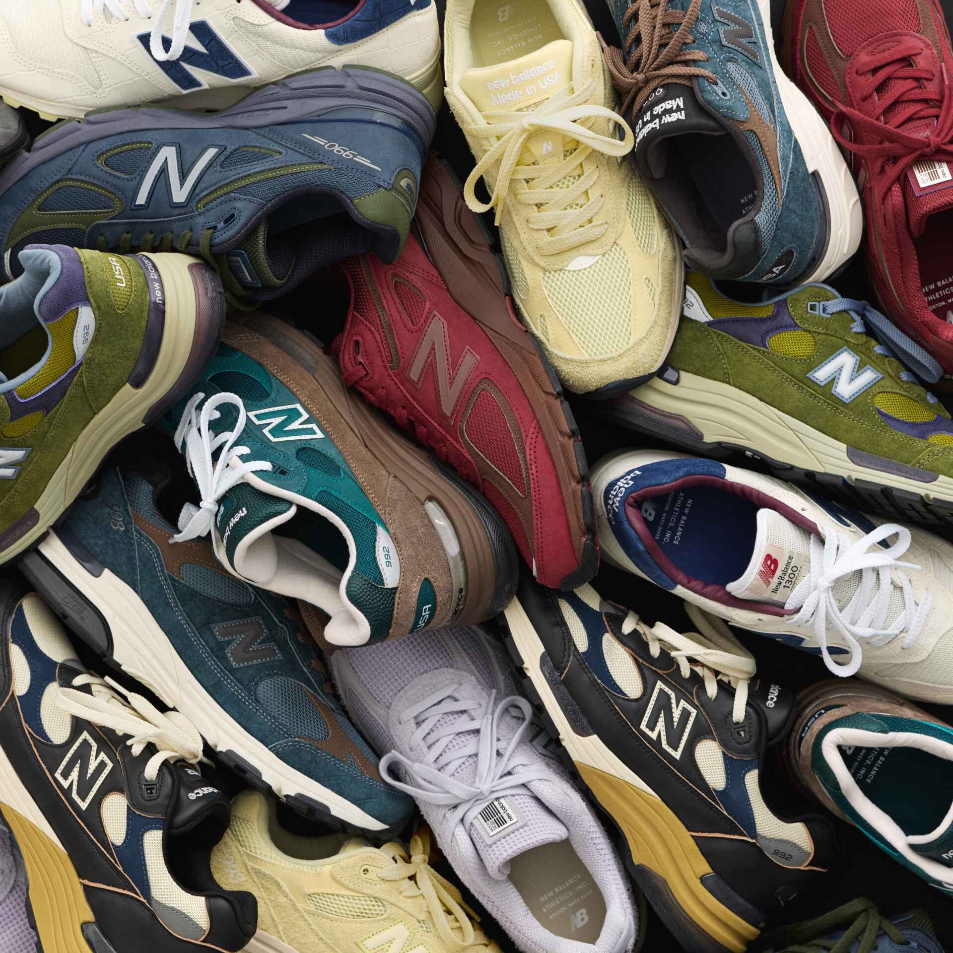 A top-down image of many New Balance sneakers.