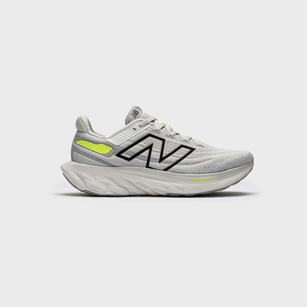 One grey Fresh Foam X 1080v13 shoe in studio on a grey background.  